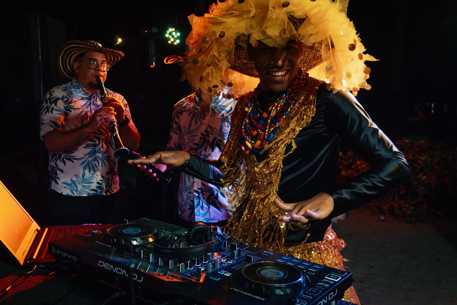 DJ and live clarinet player performing alongside a costumed specialty performer
